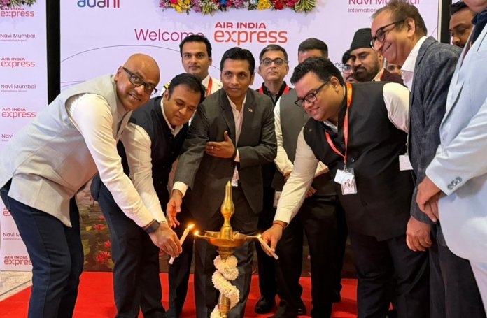 Arun-Bansal-CEO-and-Nirpendra-Singh-Head-–-Aero-Adani-Airports-with-the-Air-India-Express-leadership-team-at-the-inauguration-of-Air-India-Express-flight-operations-from-Navi-Mumbai-Intern